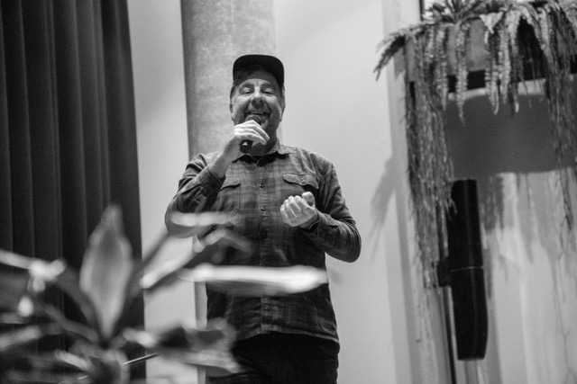 Comedian performing on stage